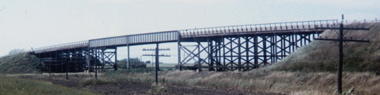 Metal beam and wood tressle bridge