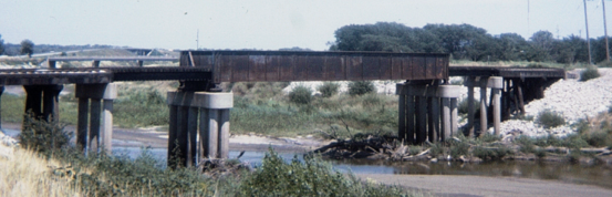 Metal beam and concrete pilars bridge